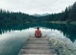 person sitting on dock meditating for anxiety relief