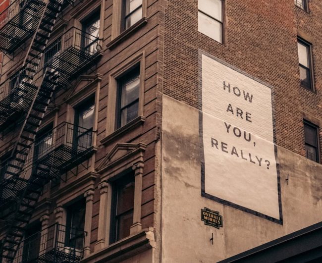 Brown Building with Sign "How Are You Really?"