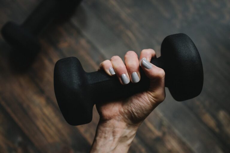 person holding dumbbell