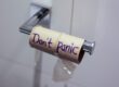 Empty tissue roll with "Don't Panic" written on it