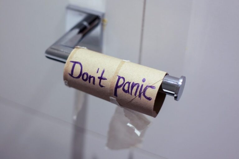 Empty tissue roll with "Don't Panic" written on it