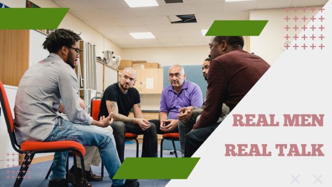 Men sit on chairs in a circle looking at each other and appearing to engage in conversation and connection during a Peer Group for Healthy Masculinity
