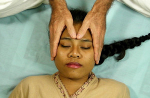 Woman receiving craniosacral therapy